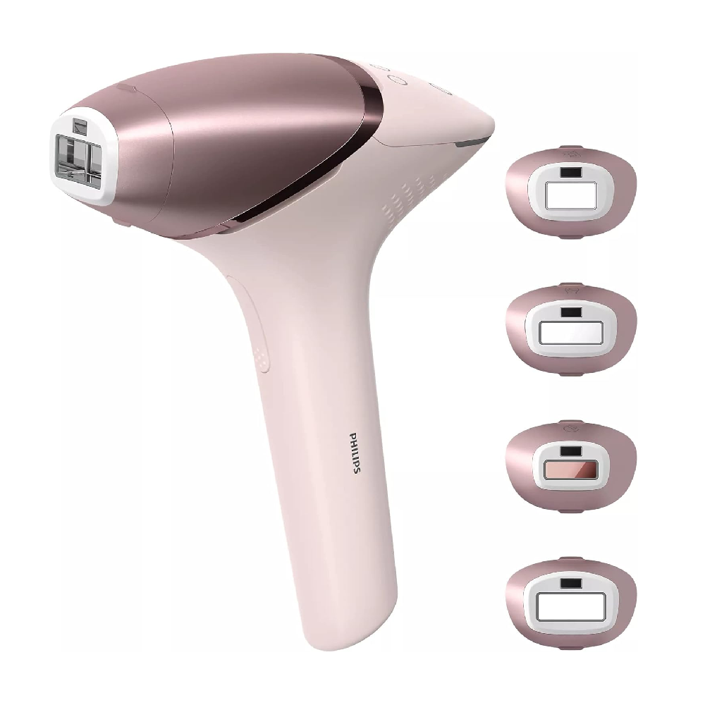 Philips laser hair removal device with multiple attachments on a white background